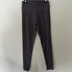 Victoria’s Secret heather purple and black stirrup leggings.